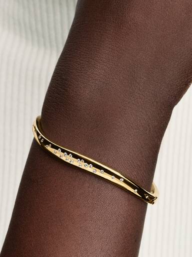 14k gold-plated bangle with clear cubic zirconia