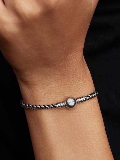 Braided sterling silver box chain bracelet with black textile cord