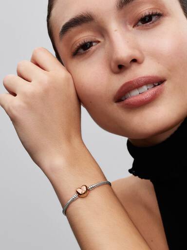 Silver bracelet with heart-shaped 14k rose gold-plated clasp