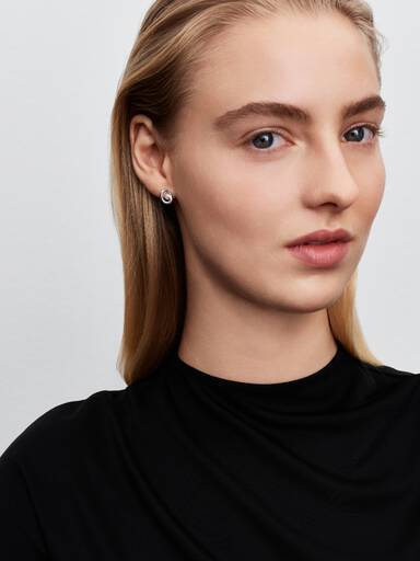 Sterling silver stud earrings with white treated freshwater cultured pearl