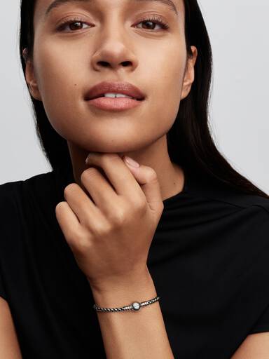 Braided sterling silver box chain bracelet with black textile cord