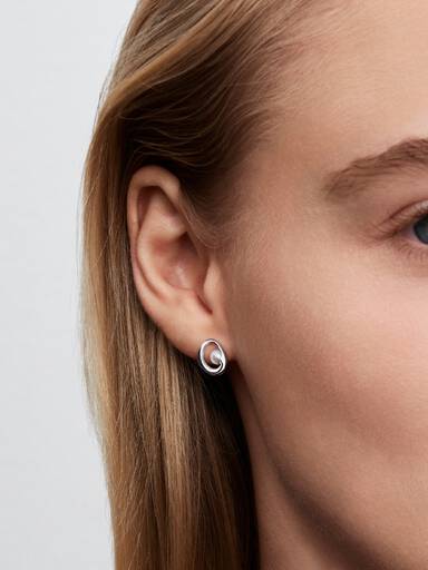 Sterling silver stud earrings with white treated freshwater cultured pearl
