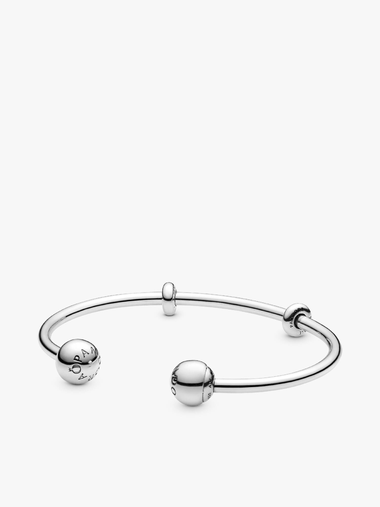 Silver open bangle with silicone stoppers and interchangeable end caps